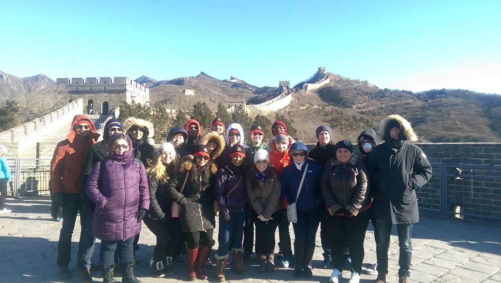 A group of Cornell MBA students on a trek. Mountain in the background.
